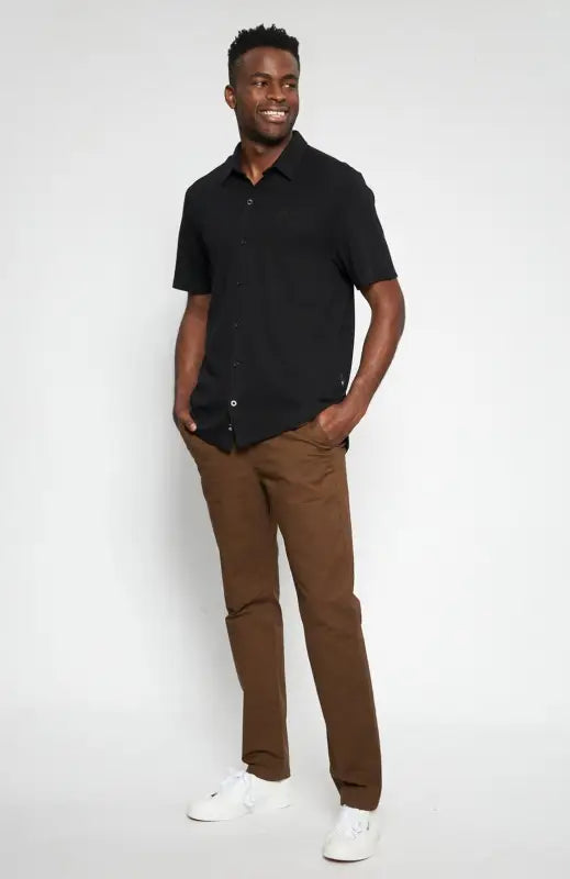 Men’s short-sleeved black collared shirt.