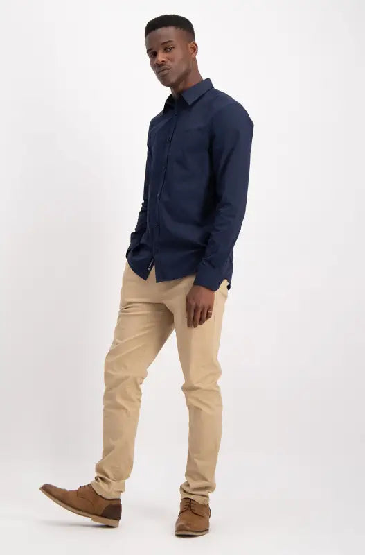 Men’s navy long-sleeved button-up shirt.