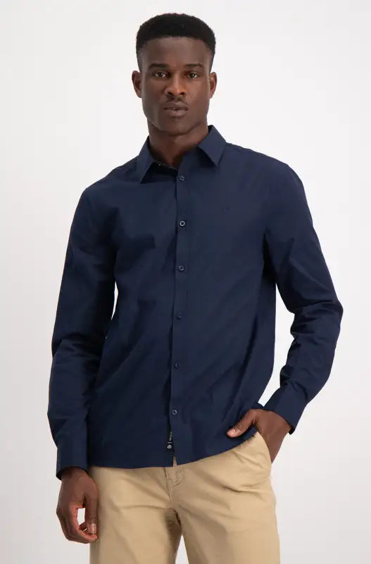Men’s navy blue long-sleeved button-up shirt.
