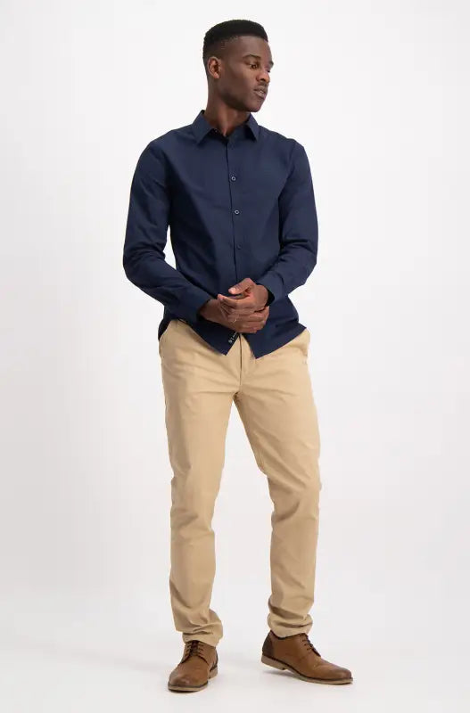 Men’s navy blue long-sleeve collared shirt.