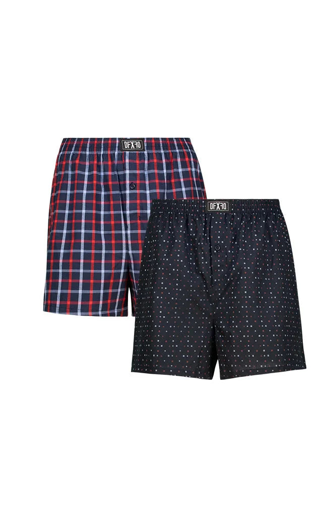 A two-pack of men’s boxer shorts, one with a red and blue plaid pattern and the other black with white polka dots.