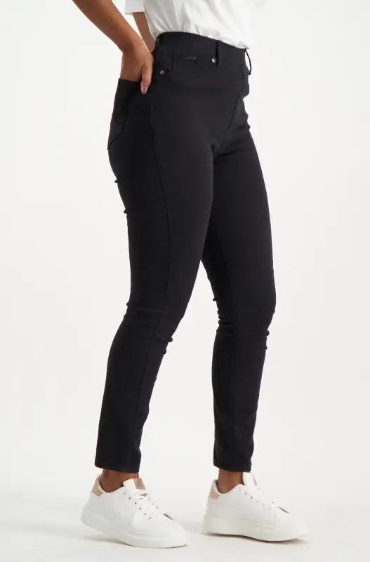 Women’s black skinny jeans with a high waist.