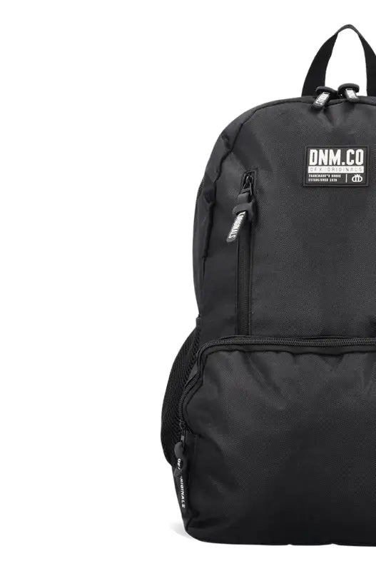 Black fabric backpack with multiple zippered compartments.