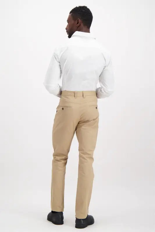Men’s white long-sleeve dress shirt and khaki dress pants.