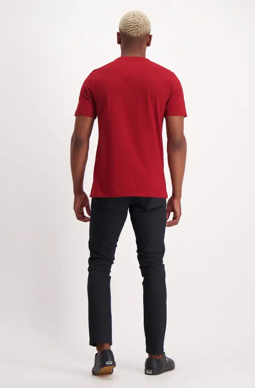 Men’s red t-shirt with black pants and black shoes