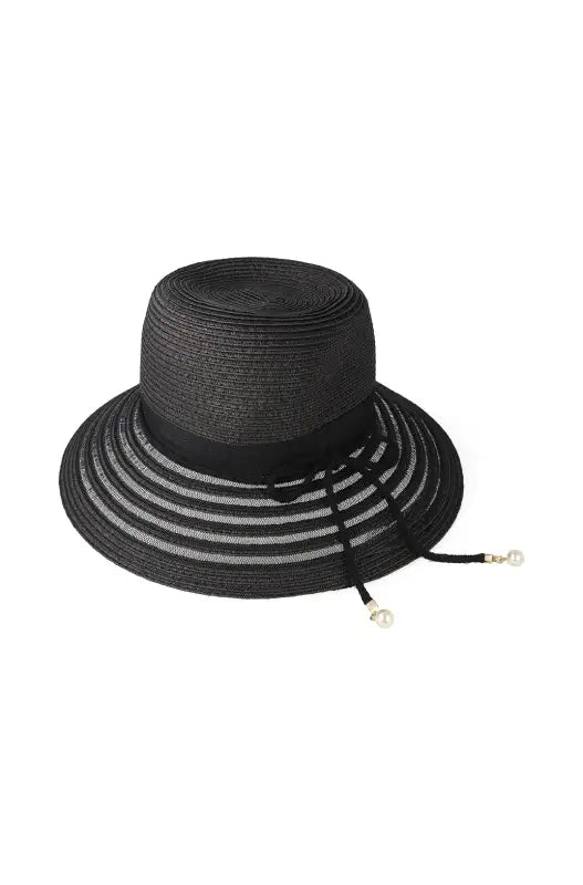 Black straw sun hat with a striped brim and pearl-tipped drawstring.