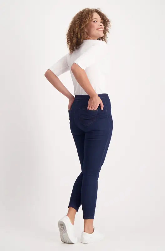 Women’s white short-sleeved top and navy blue slim-fit pants