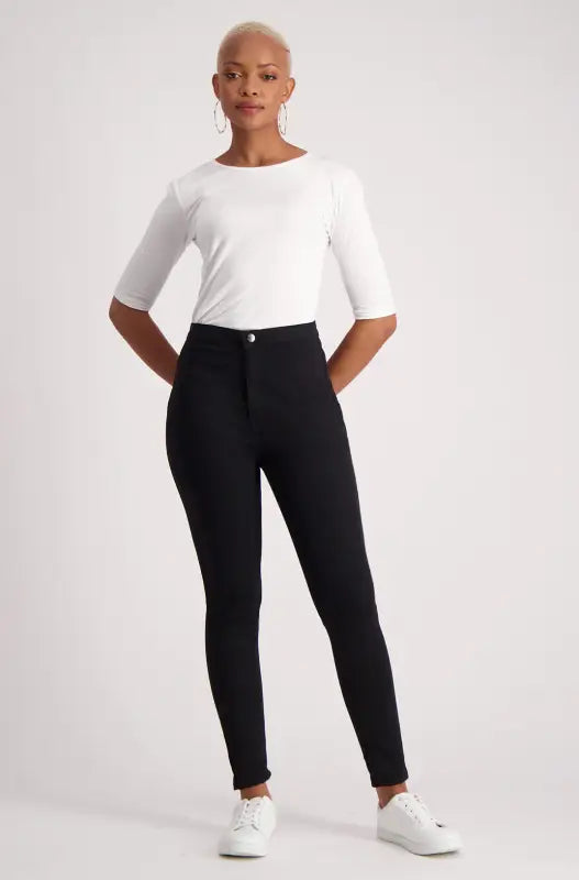 Women’s high-waisted black skinny jeans.