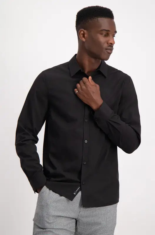 Men’s black long-sleeve button-up shirt.