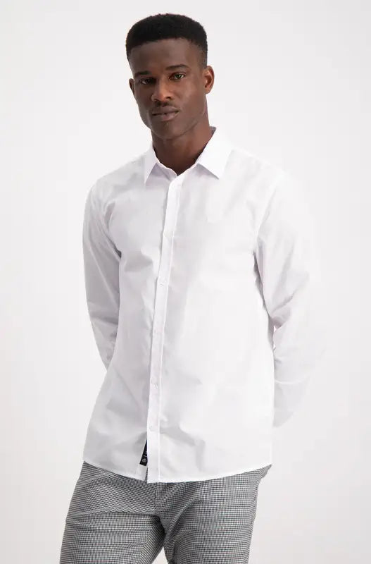 Men’s white long-sleeved button-down shirt with a collar.