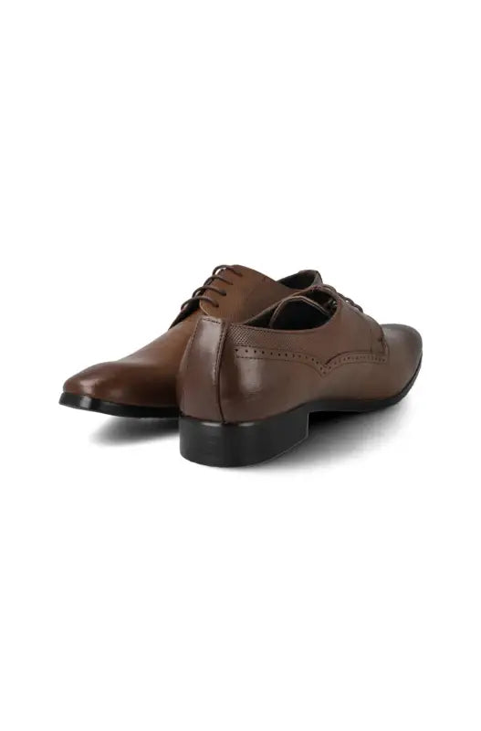 A pair of brown leather lace-up dress shoes with brogue detailing.