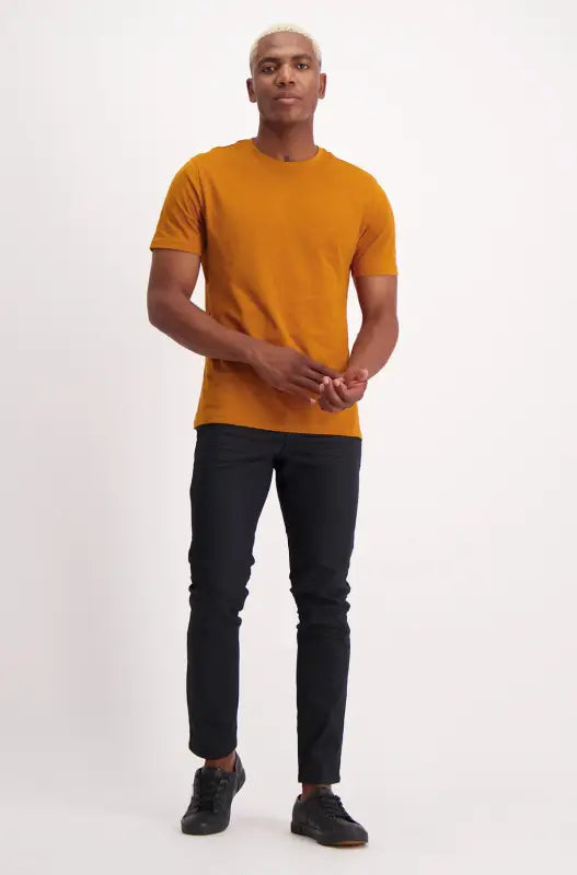 A men’s short-sleeved mustard yellow t-shirt.