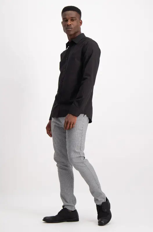 Men’s black long-sleeved button-down shirt with a collar.