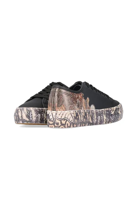 Black canvas platform sneakers with a detailed, light-colored abstract design on the soles.