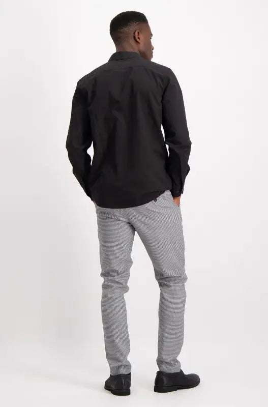 Men’s black long-sleeve dress shirt.