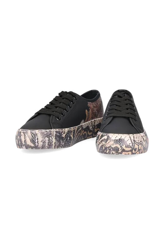 Black canvas platform sneakers with a detailed, patterned sole.