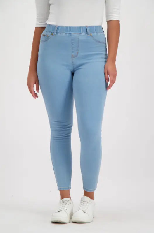 Light blue stretch denim jeggings with an elastic waistband and gold stitching.