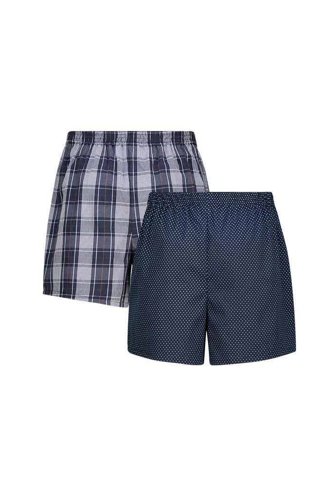 A two-pack of men’s woven boxer shorts, one in blue plaid and the other in navy with a white polka dot pattern.
