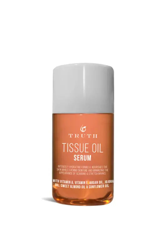 A bottle of tissue oil serum with a white cap, filled with an amber-colored liquid.