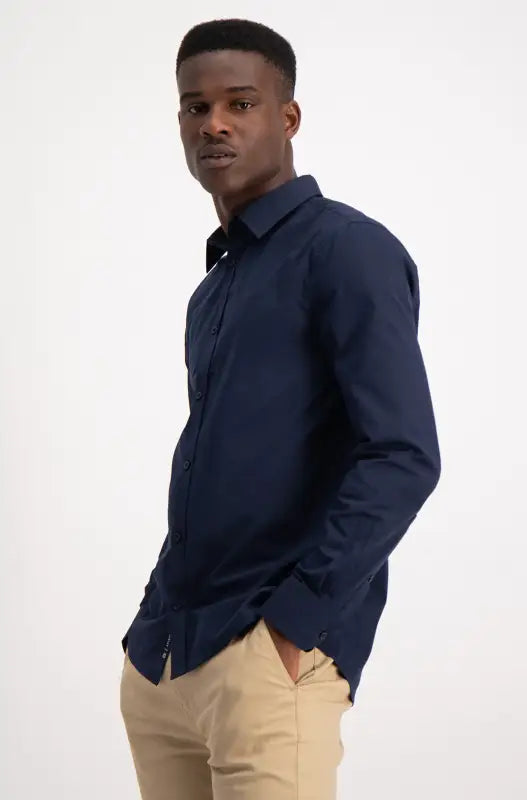 A dark blue collared long-sleeved shirt.