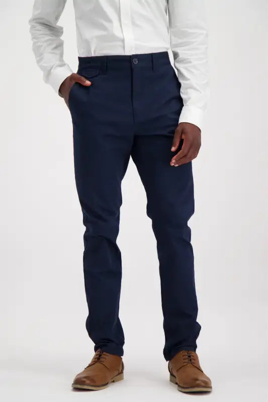 Men’s navy blue slim-fit dress pants with brown lace-up shoes