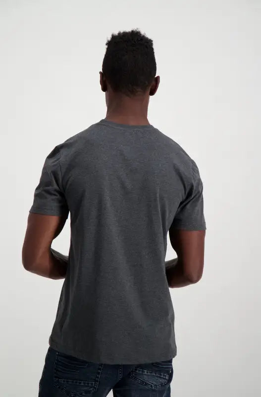 Dark gray short-sleeve t-shirt on a person.