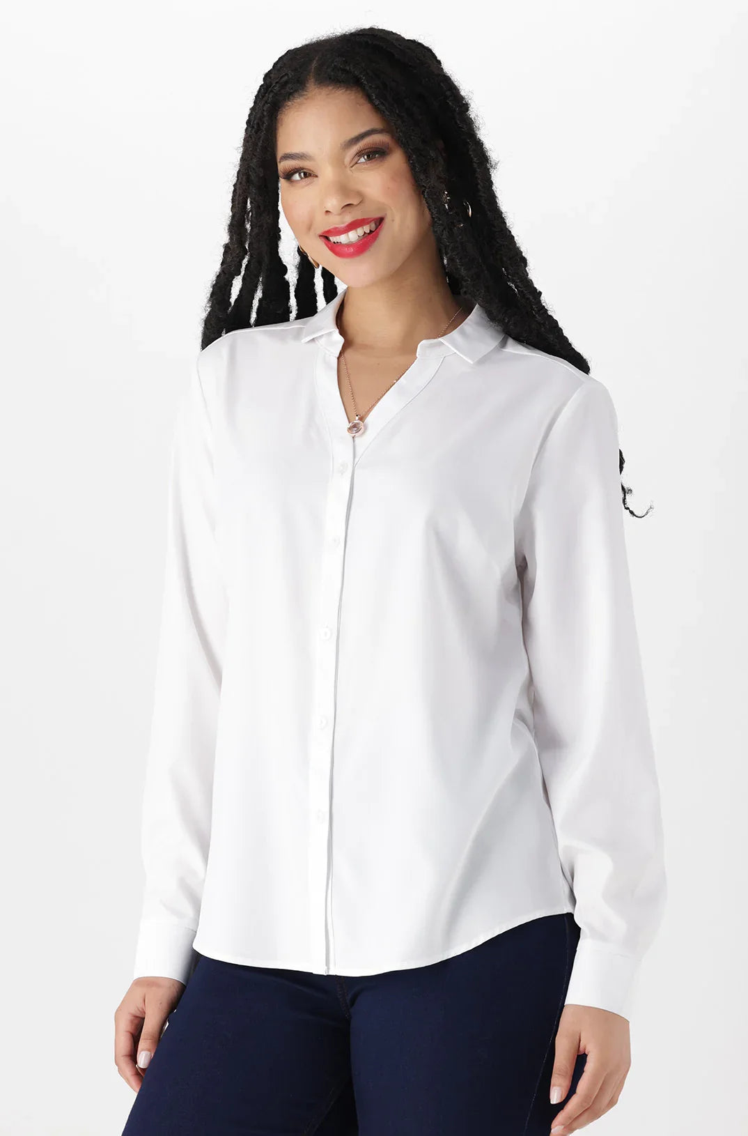 A woman’s white long-sleeved collared shirt with a partial zipper closure.
