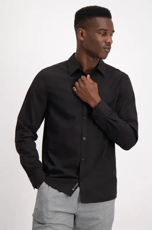 Men’s black long-sleeved button-up shirt.