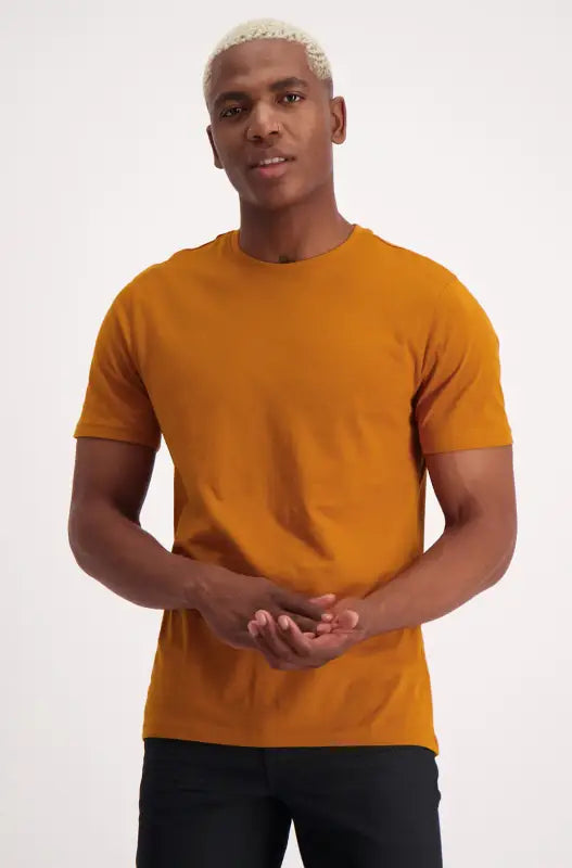 Men’s short-sleeved mustard yellow crew-neck t-shirt.