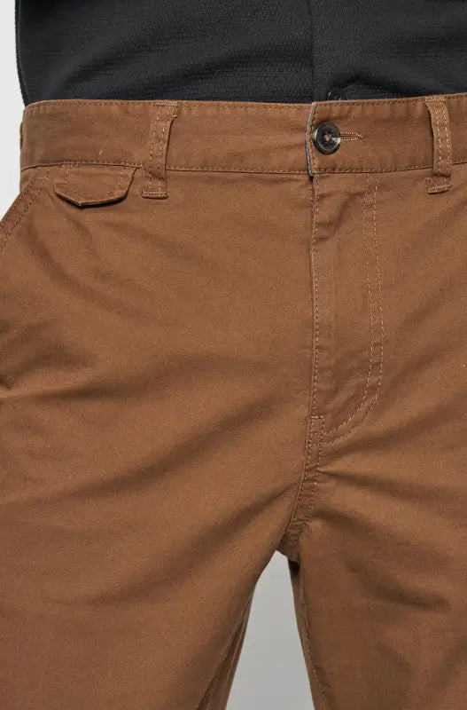 Brown chino pants with a button closure and belt loops.